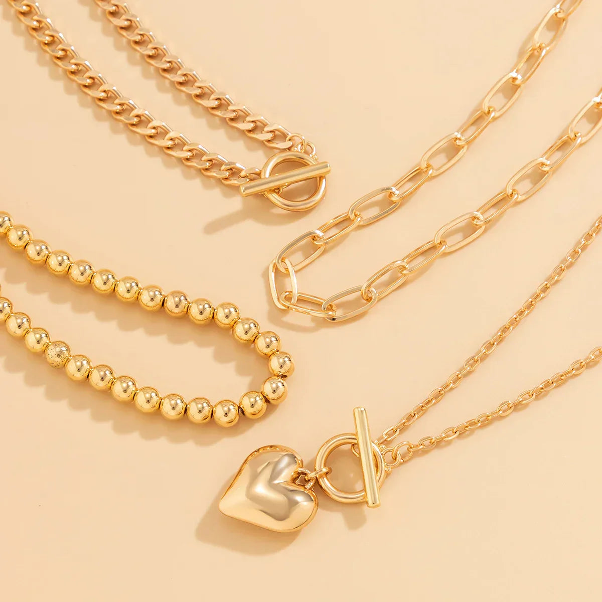 HeartGleam Necklace Set – Gold Heart Pendants